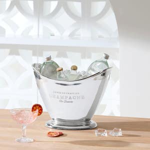 https://s3-ap-southeast-2.amazonaws.com/fusionfactory.commerceconnect.bbnt.production/pim_media/000/174/085/M_F_Summer_S24-25_LS_Studio_Barware-Champagne_Bucket_Flared_Pewter.jpg?1729746455