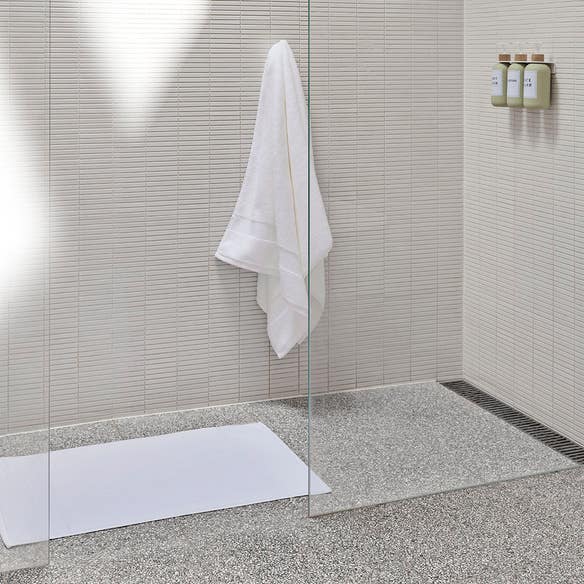 https://s3-ap-southeast-2.amazonaws.com/fusionfactory.commerceconnect.bbnt.production/pim_media/000/200/494/M_F_Summer_S25-26_LS_Bathroom_Towel_Bathmat-Ultra_Soft_White_SI.jpg?1757027816