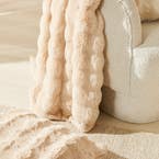 https://s3-ap-southeast-2.amazonaws.com/fusionfactory.commerceconnect.bbnt.production/pim_media/000/161/321/M_F_W24_LS_Throw_Cushion_Blanket_Faux_Fur_Malmo_Pumice_SI.jpg?1709166694